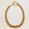 Collana con catena a maglie decrescenti color oro antico e chiusura a forma di stella