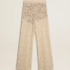Pantaloni da donna in pizzo trasparente color crema