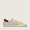 Super-Star CNY da donna in pelle scamosciata avorio con stella in pelle metallizzata e linguetta sul tallone in pelle