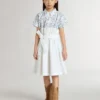 Abito camicia da bambina in tela di cotone bianca con stampa nautica blu e bordino bianco