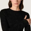 Abito lungo da donna in rete nera con paillettes nere