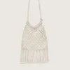 Borsa da donna in macramè in cotone color burro con ciondolo a forma di aragosta in pelle