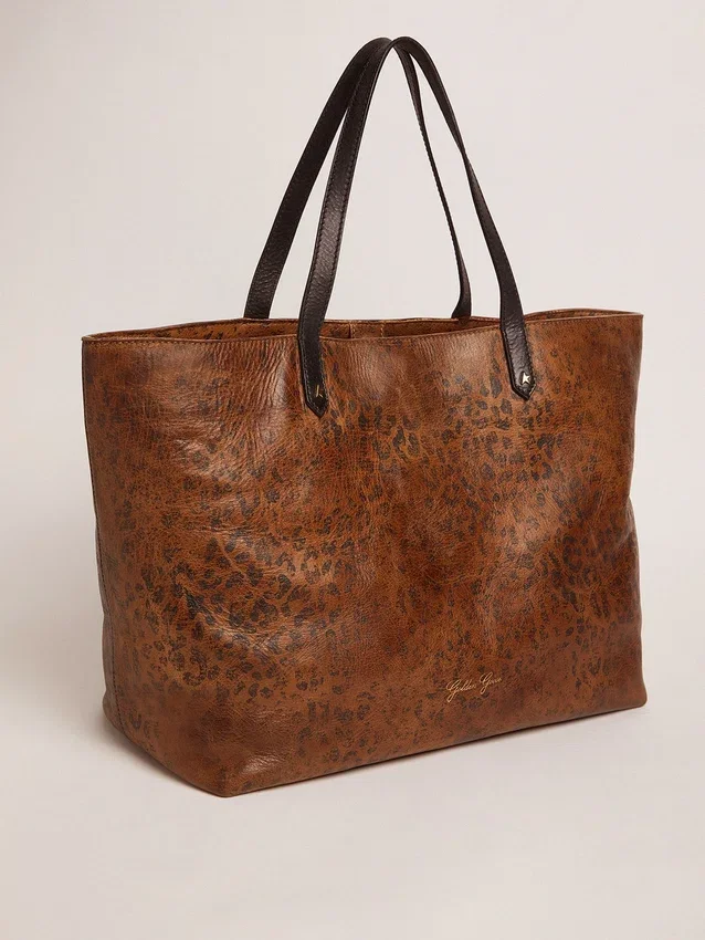 Borsa Pasadena in pelle martellata con stampa leopardata e manici neri a contrasto