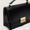 Borsa Venezia in pelle nera rigida con dettagli dorati