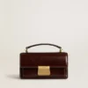 Borsa Venezia piccola in pelle laminata marrone scuro con dettagli dorati