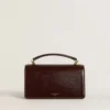 Borsa Venezia piccola in pelle laminata marrone scuro con dettagli dorati