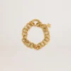 Bracciale a catena intrecciata color oro antico con chiusura a forma di stella