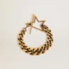 Bracciale con catena a maglie decrescenti color oro antico e chiusura a forma di stella
