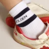 Calzini a costine con strisce blu navy e logo