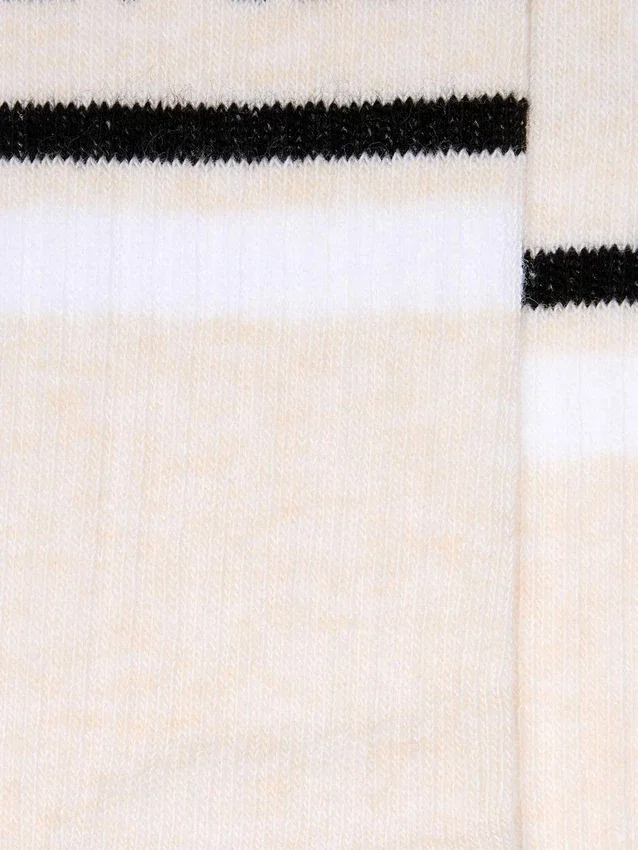 Calzini color cipria con dettagli consumati e strisce bianche e nere
