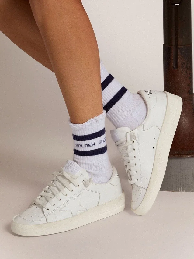 Calzini in cotone con finiture consumate, strisce blu e logo