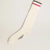Calzini lunghi a coste in bianco vintage con strisce bicolori