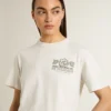 Camicia bianca da donna con stampa nera sul petto