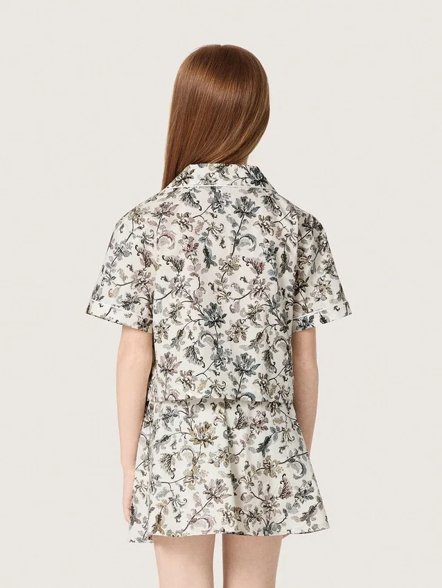 Camicia da bambina Journey a maniche corte in tela di cotone bianca con stampa floreale verde
