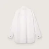 Camicia oversize da donna in cotone bianco con dettagli plissettati e bottoni gioiello