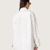 Camicia oversize da donna in cotone bianco con dettagli plissettati e bottoni gioiello