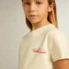 Camicie da bambina in cotone bianco slavato con ricamo rosso sul petto