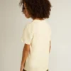 Camicie da bambino in bianco consumato con scritte multicolori