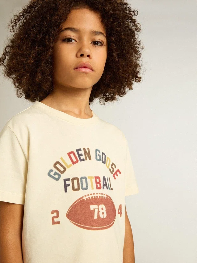 Camicie da bambino in bianco consumato con scritte multicolori
