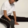 Camicie da donna bianche con logo glitterato argento e stella
