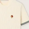 Camicie da donna in maglia bianca con bordi a contrasto e spilla rimovibile