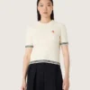Camicie da donna in maglia bianca con bordi a contrasto e spilla rimovibile