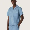 Camicie unisex in denim azzurro con ricamo sul retro