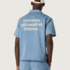Camicie unisex in denim azzurro con ricamo sul retro