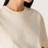 Camicie unisex “Star” in cotone bianco con cristalli sfumati su tutta la superficie e stampa sul retro