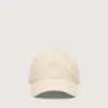 Cappellino da baseball color ecrù con stella ricamata tono su tono