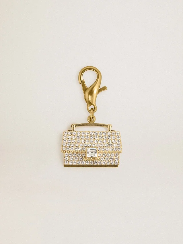 Ciondolo a forma di borsetta in ottone color oro con cristalli