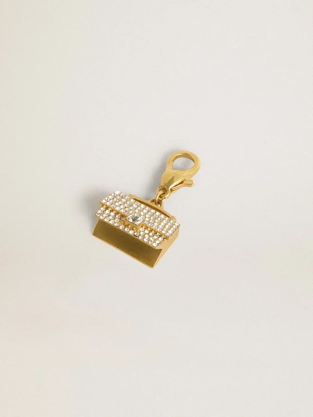 Ciondolo a forma di borsetta in ottone color oro con cristalli
