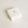Ciondolo a forma di borsetta in ottone color oro con cristalli