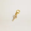 Ciondolo a forma di chiave in ottone color oro con cristalli