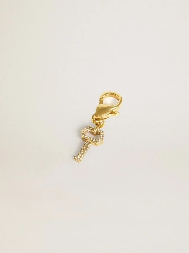Ciondolo a forma di chiave in ottone color oro con cristalli