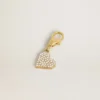 Ciondolo a forma di cuore in ottone color oro con cristalli