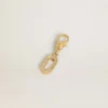 Ciondolo a forma di lettera O in ottone color oro con cristalli