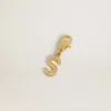 Ciondolo a forma di lettera S in ottone color oro con cristalli