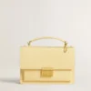 Ciondolo a forma di lettera U in ottone color oro con cristalli