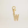 Ciondolo a forma di lettera W in ottone color oro con cristalli
