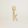 Ciondolo con la lettera K in ottone color oro con cristalli