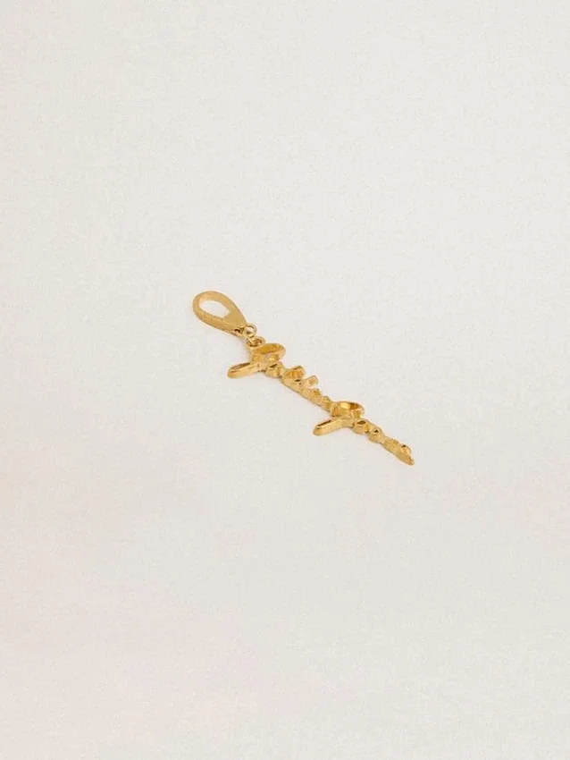 Ciondolo in ottone color oro con firma golden goose
