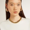 Collana con catena a maglie decrescenti color oro antico e chiusura a forma di stella