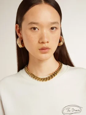 Collana con catena a maglie decrescenti color oro antico e chiusura a forma di stella