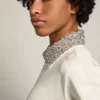 Felpa con zip della Star Collection in bianco papiro con colletto in cristalli