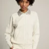 Felpa con zip della Star Collection in bianco papiro con colletto in cristalli