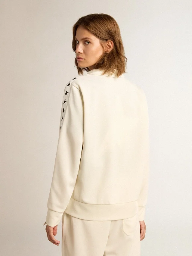 Felpa da donna bianca con zip, striscia bianca e stelle nere