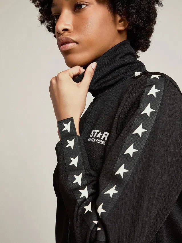 Felpa da donna nera con zip e stelle bianche