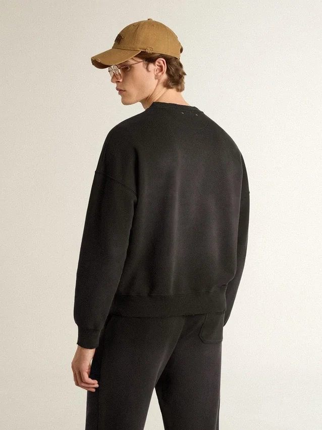 Felpa unisex in cotone nero effetto consumato con logo ricamato