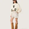 Camicia da donna squadrata in cotone con stampa floreale in bianco e nero